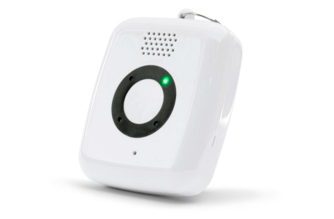 A small, rectangular white electronic device with a circular black button in the center and a green light indicator on the front.